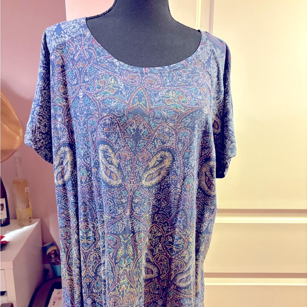NWT multi-colored patterned loose fit top with v split at back of waist.